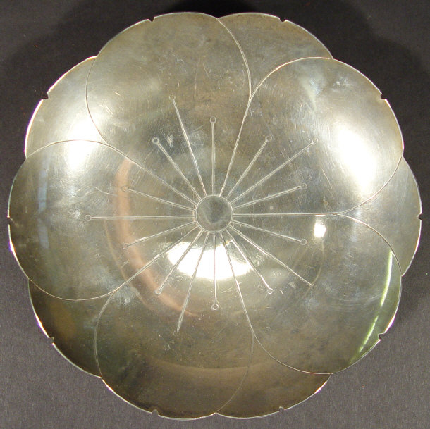 Appraisal: Silver flowers head design four-footed dish Sheffield cm diameter