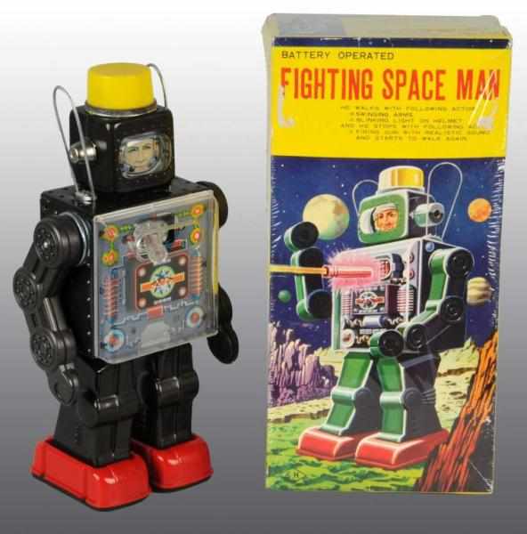 Appraisal: Tin Fighting Space Man Battery-Operated Toy Description Japanese Working Made