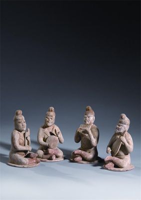 Appraisal: A set of four Chinese unglazed pottery models of male