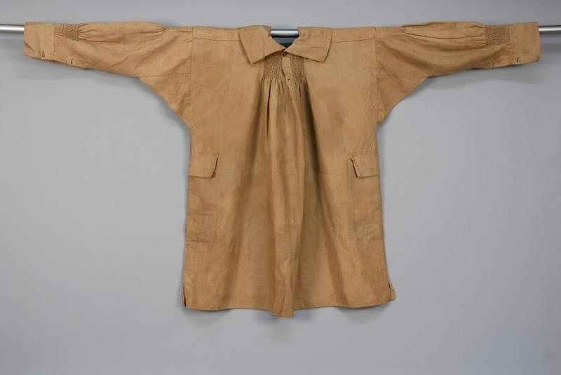 Appraisal: MAN S SQUARE-CUT WORK SMOCK th C Heavy brown linen