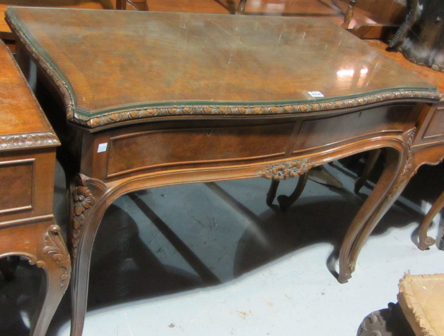 Appraisal: A th century walnut serpentine card table