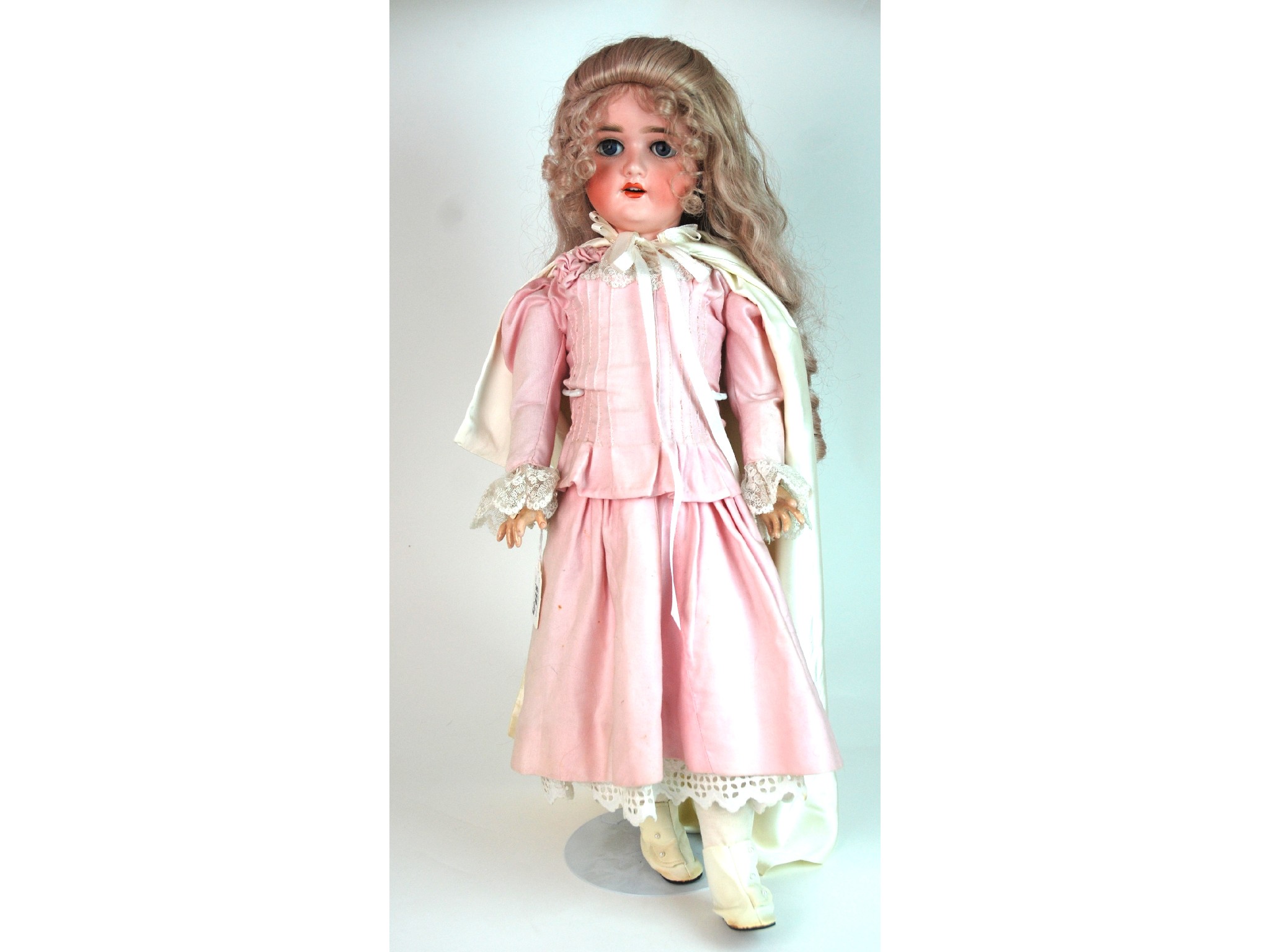 Appraisal: A Schoenau and Hoffmeister bisque-headed dollwith open and close blue