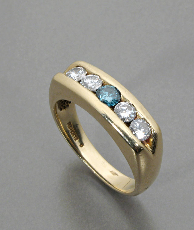 Appraisal: MAN'S DIAMOND AND FOURTEEN KARAT GOLD RING channel set with