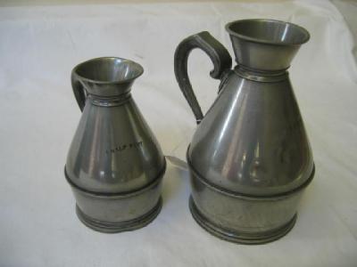 Appraisal: TWO IRISH PEWTER HAYSTACK MEASURES of pint and half pint