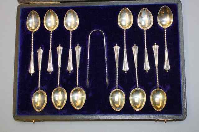 Appraisal: A CASED SET OF TWELVE SILVER TEASPOONS with twisted and