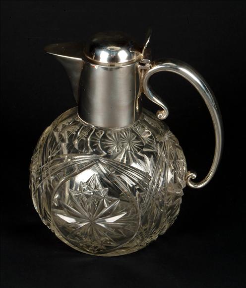 Appraisal: A silver mounted cut glass claret jug by Hukin Heath