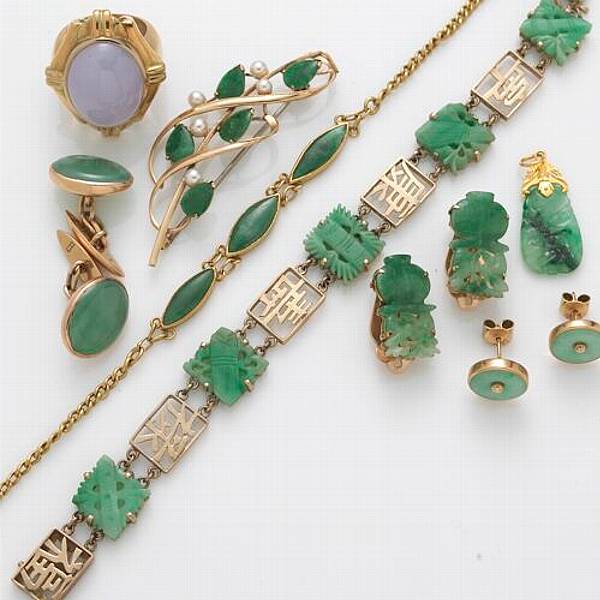 Appraisal: A collection of jade and k gold jewelry including bracelets