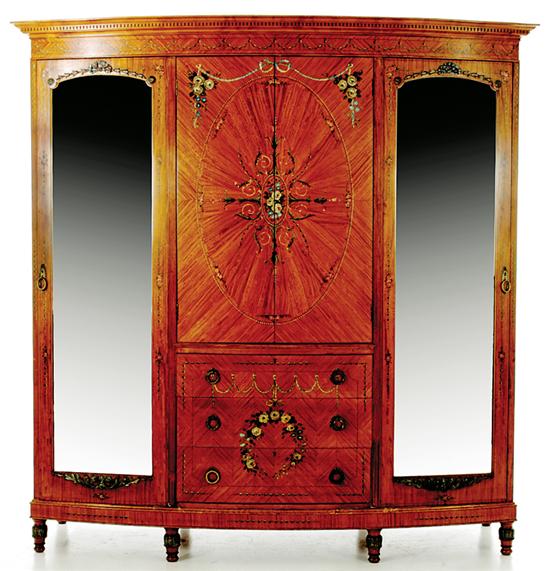 Appraisal: Edwardian satinwood and paint-decorated bowfront armoire English early th century