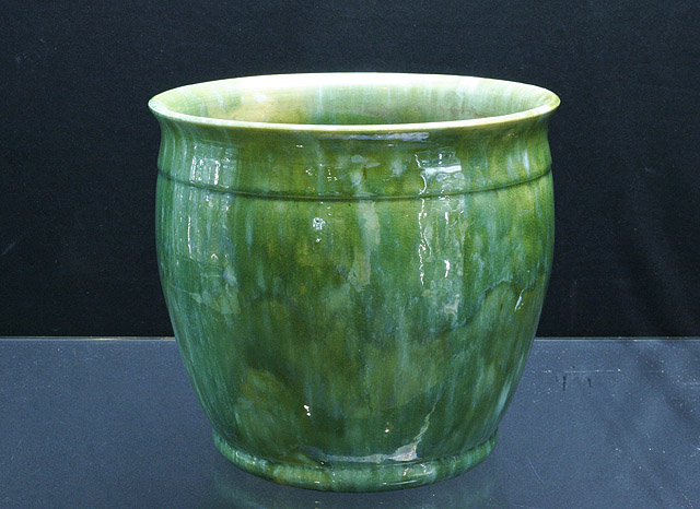 Appraisal: A Tasmanian green glazed pottery jardiniere by John Campbell cms