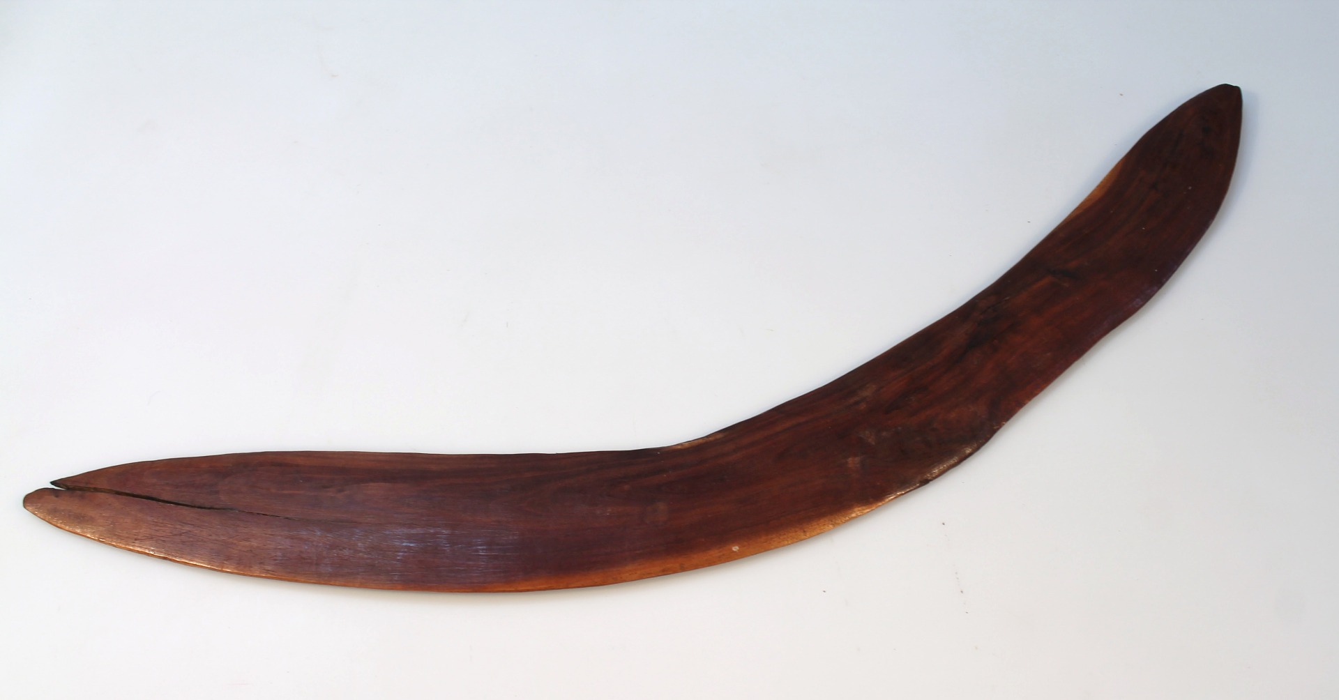 Appraisal: An Australian tribal hardwood boomerang undecorated probably thC cm wide