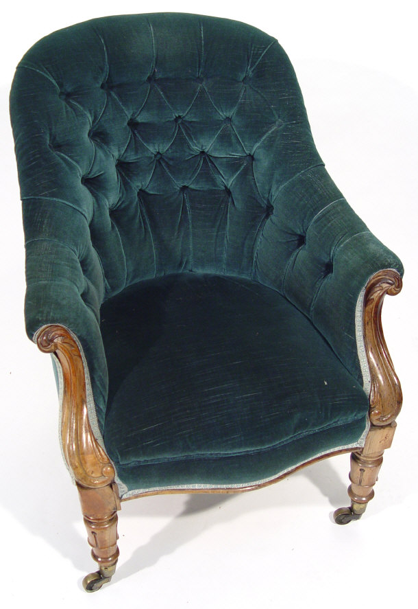 Appraisal: Victorian rosewood framed armchair with carved scroll shaped arms and