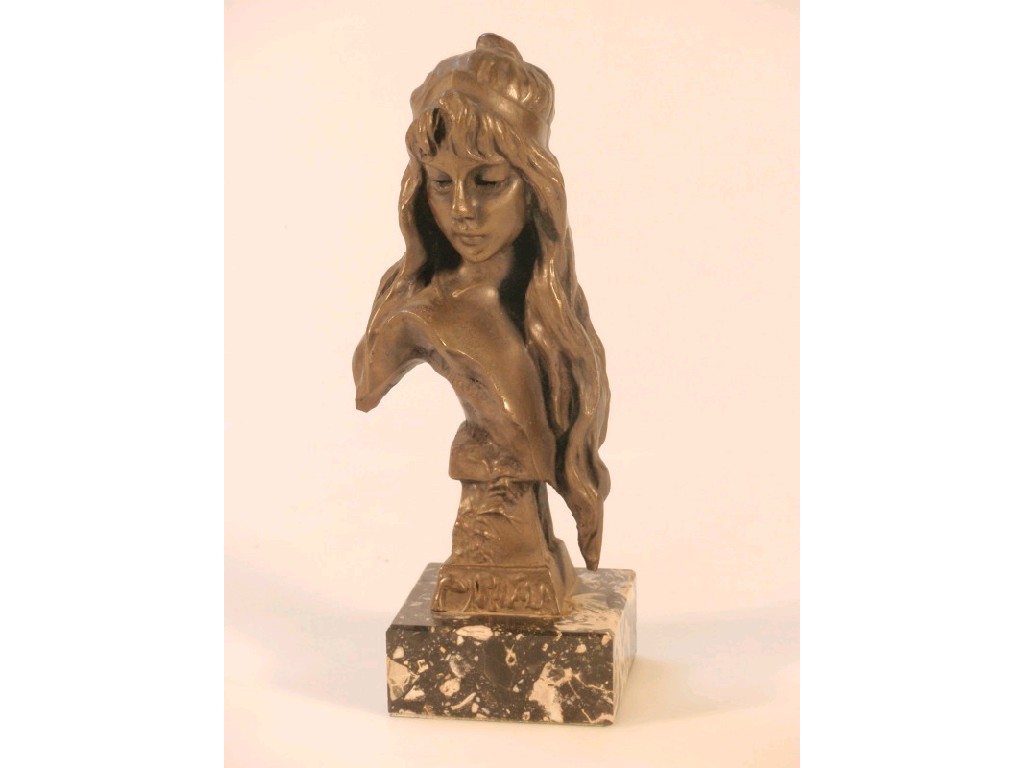 Appraisal: A thC bronze resin bust of a long haired damsel