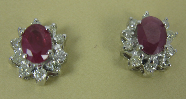 Appraisal: PAIR OF RUBY AND FOURTEEN KARAT GOLD EARRINGS each is