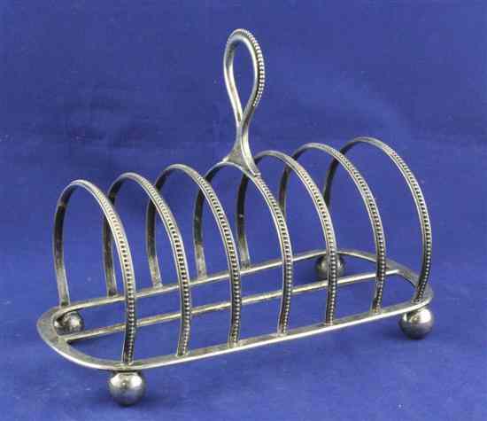 Appraisal: A Victorian silver seven bar toastrack of oval form with