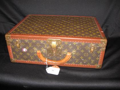 Appraisal: Small Louis Vuitton hardside suitcase With LV fabric and leather