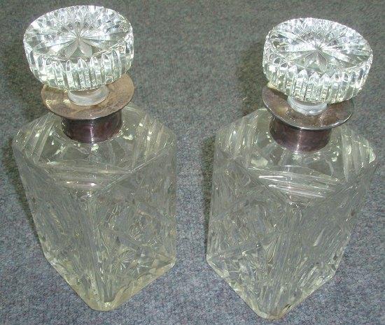 Appraisal: A pair of silver mounted cut glass decanters of square