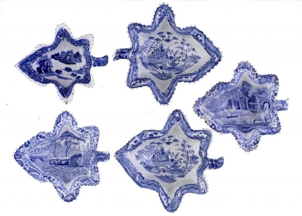 Appraisal: FIVE SPODE BLUE PRINTED EARTHENWARE PICKLE DISHES vine leaf shape