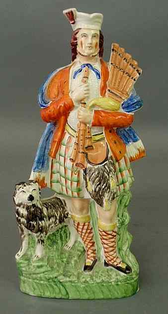 Appraisal: Colorful th c Scottish bagpiper with dog h