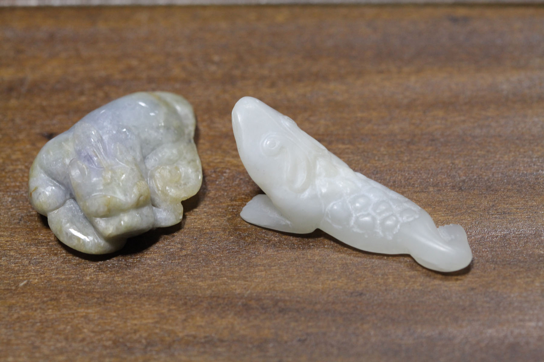 Appraisal: TWO CARVED STONES Asian th century probably jade White lizard