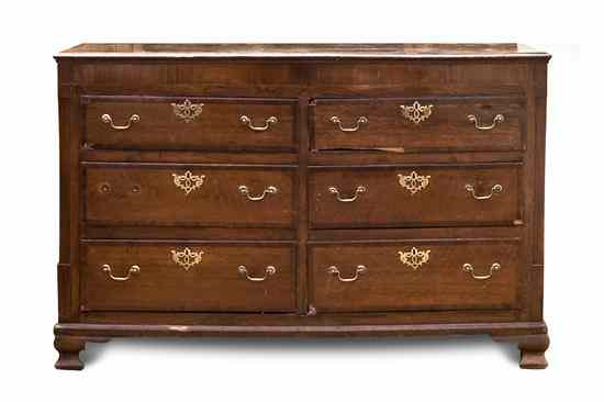 Appraisal: An English Provincial Oak Chest of Drawers having a rectangular