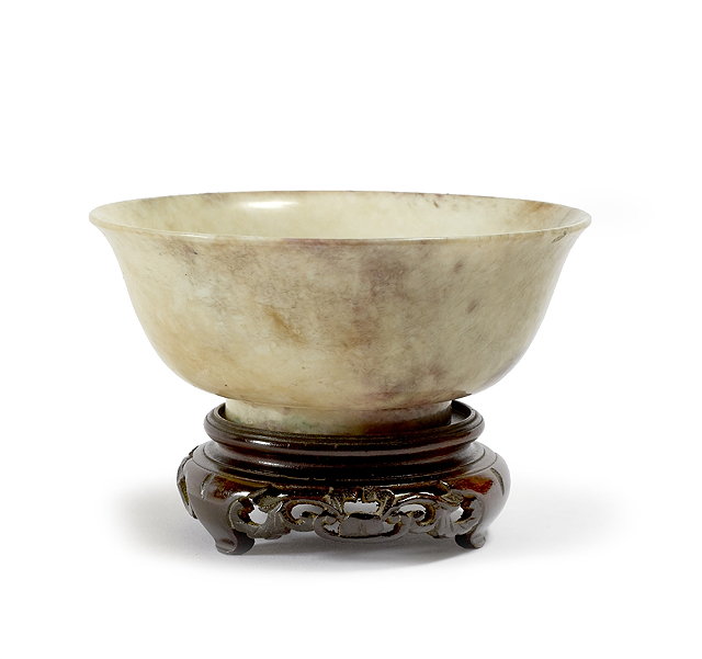 Appraisal: A Chinese burnt jade bowlMing Dynasty - of pale oatmeal