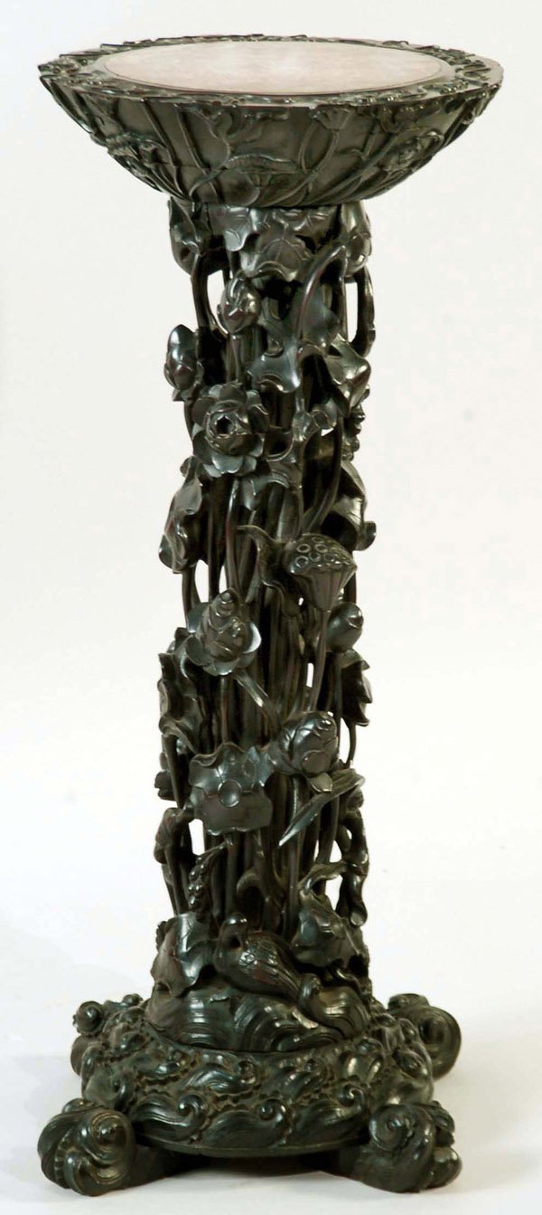 Appraisal: An extremely elaborate and high relief carved fern stand in