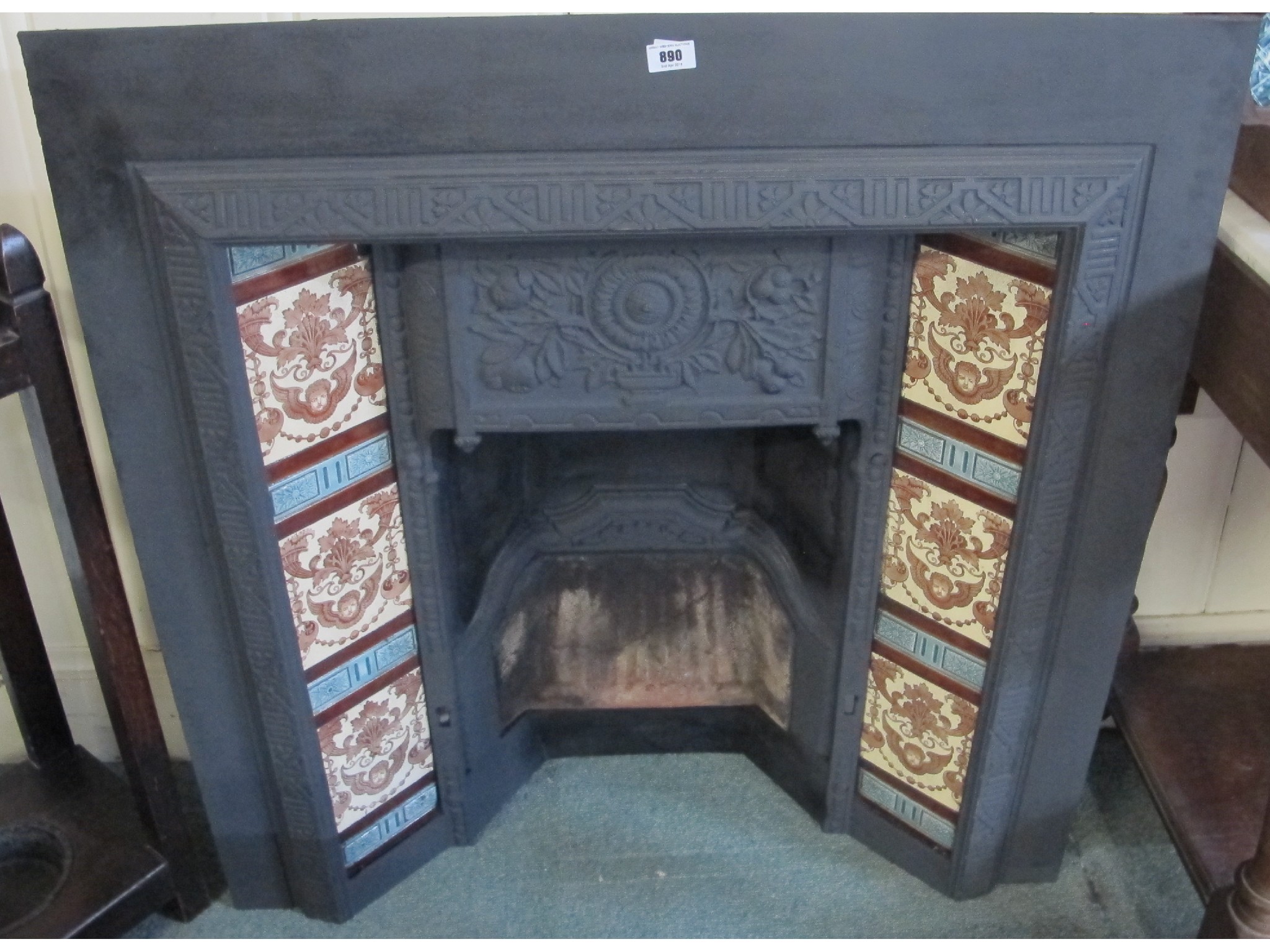 Appraisal: A tiled cast iron fireplace