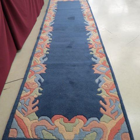 Appraisal: Chinese Handmade Sculptured Runner blues with colorful border ' x