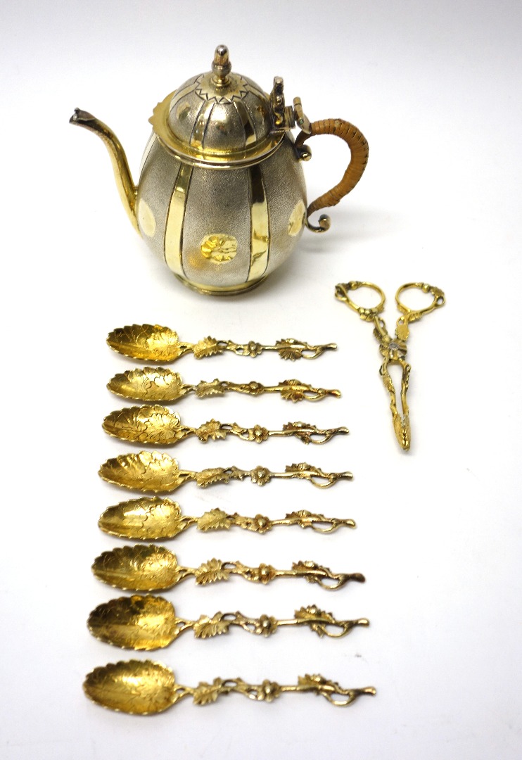 Appraisal: A parcel gilt silver teapot of melon form with a