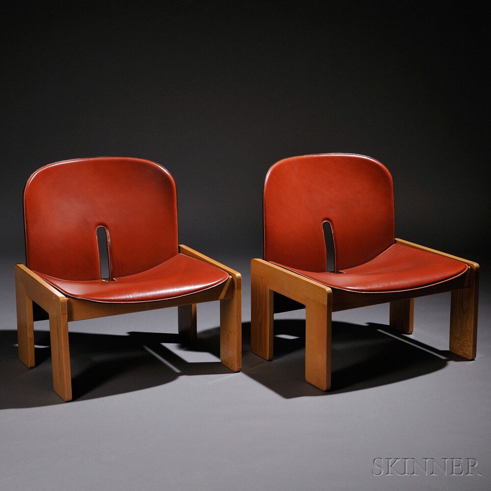 Appraisal: Two Cassina Lounge Chairs Leather and oak Cassina Italy Reddish-brown