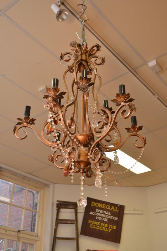 Appraisal: A DECORATIVE METAL EIGHT BRANCH CHANDELIER A DECORATIVE METAL EIGHT