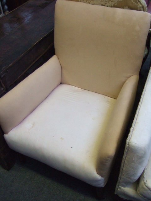 Appraisal: An Edwardian mahogany framed armchair upholstered in beige and resting