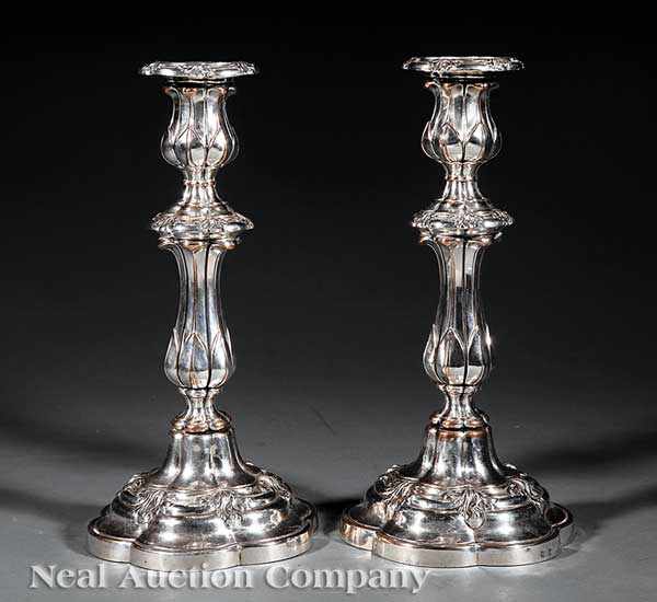 Appraisal: A Pair of Antique Sheffield Plate Candlesticks Matthew Boulton baluster