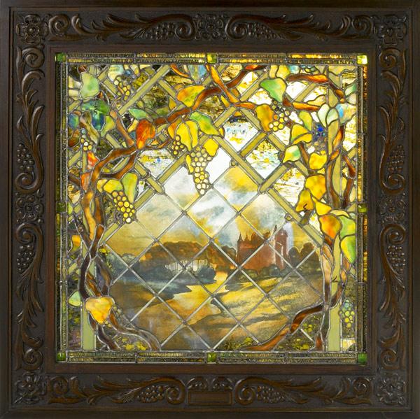 Appraisal: STAINED GLASSWindow with grape arbor in the style of TiffanyFramedProvenance