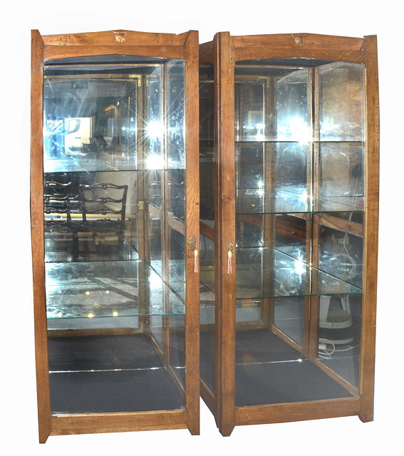 Appraisal: A PAIR OF 'S STYLE OAK DISPLAY CABINETS the interior