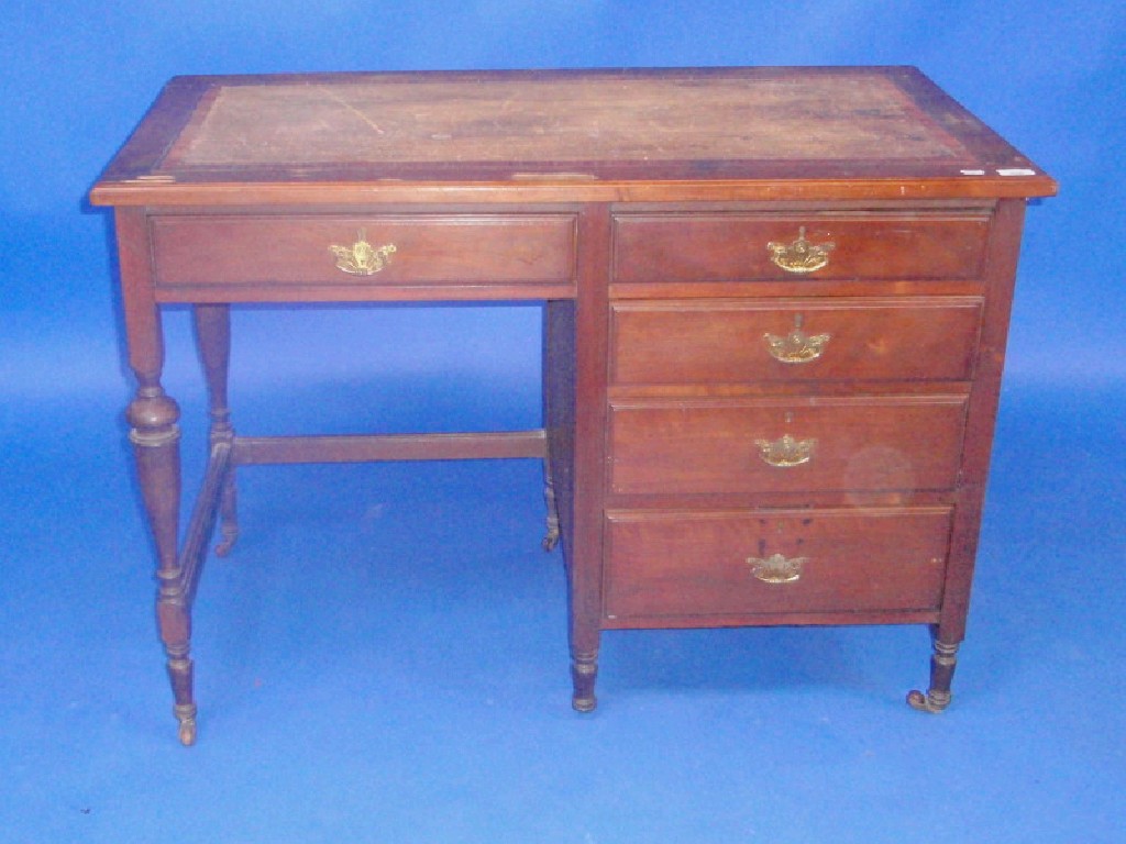 Appraisal: A late Victorian mahogany kneehole desk with rosewood and cross