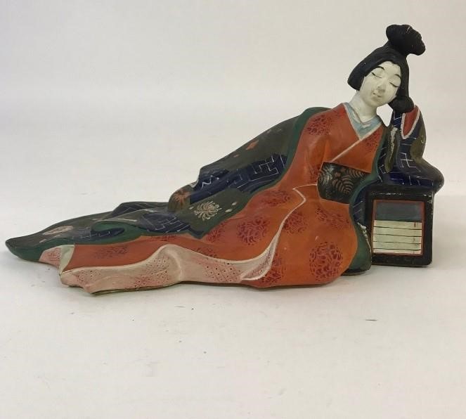 Appraisal: Colorful erotic plaster recumbent Japanese Geisha th c h x