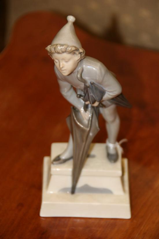 Appraisal: ROYAL COPENHAGEN FIGURE OF A BOY WITH UMBRELLAS - in