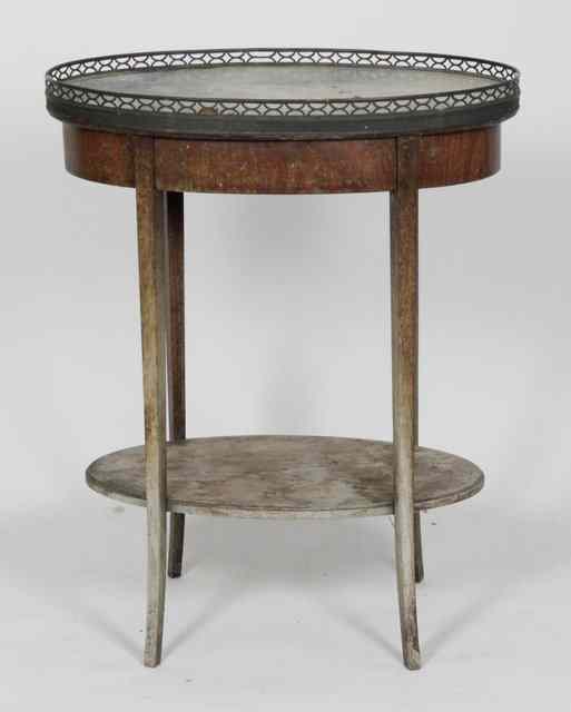 Appraisal: A marble top two-tier table with galleried border cm wide