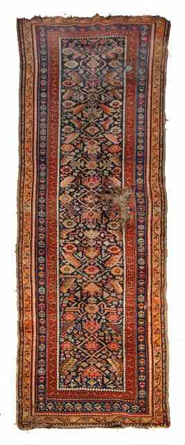 Appraisal: AN ANTIQUE PERSIAN RUNNER with central panels and stylised motifs