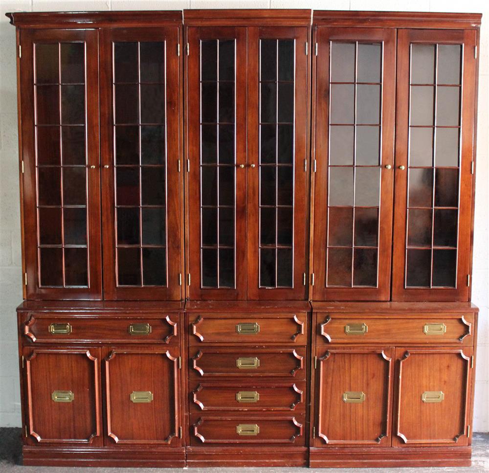 Appraisal: CAMPAIGN STYLE HOME LIBRARY CABINETS THREE SECTIONS EN SUITE each