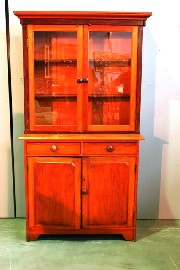 Appraisal: A pine deux-corps bookcase the glazed doors enclosing two shelves