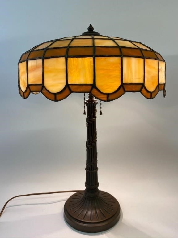 Appraisal: Clad bronze table lamp with leaded slag glass shade circa