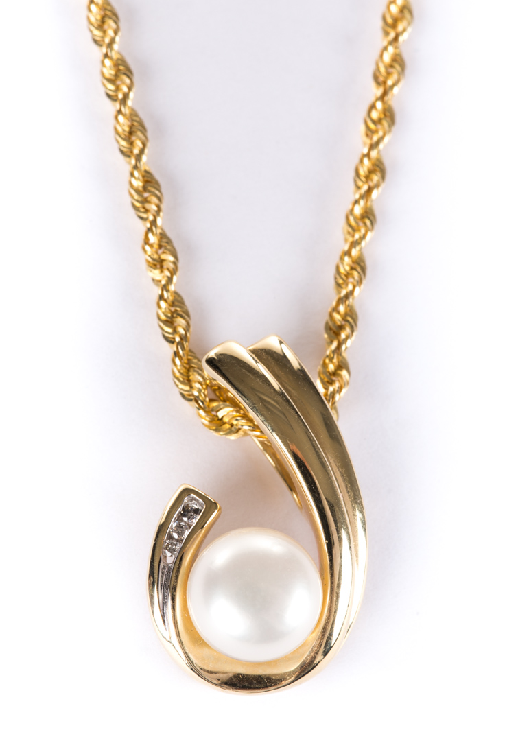 Appraisal: A Lady's Pearl and Gold Slide Necklace scroll design K