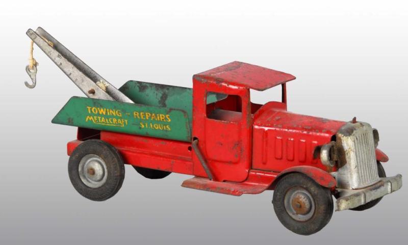 Appraisal: Pressed Steel Metalcraft Towing-Repairs Truck Toy Description American Rubber tire