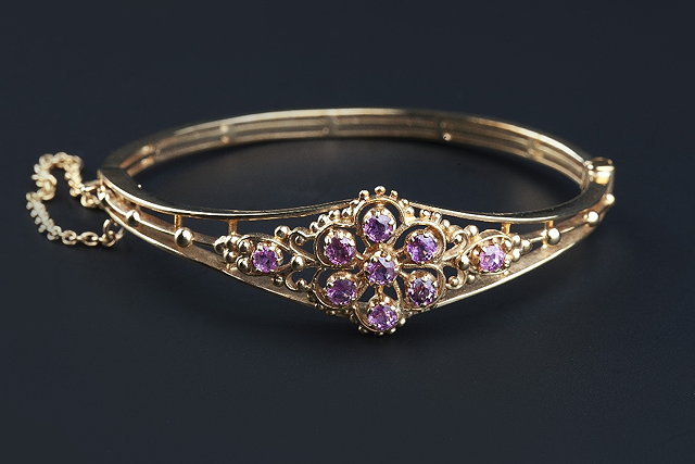 Appraisal: A ct gold and gem set bangle of hinged oval