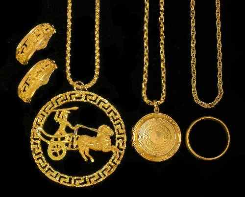 Appraisal: A modern k gold medallion with open work ''Greek Key''