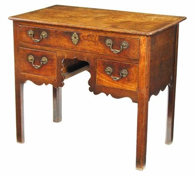 Appraisal: An early George III mahogany lowboy with a moulded edge