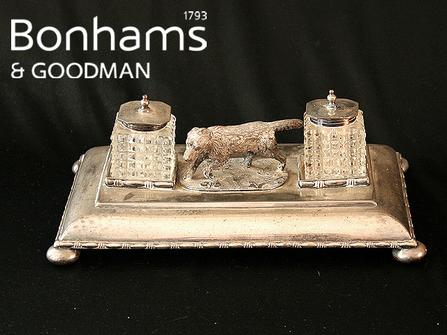 Appraisal: A desk set in silver plate fitted with a pair