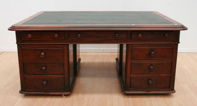 Appraisal: A Victorian mahogany pedestal partners desk with leather inset to